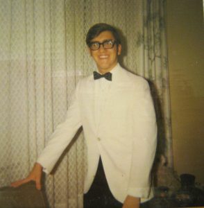 Gary Michalik, all ready to go to a St. Andrew formal event, looking dapper in a white tuxedo jacket, ca. 1970