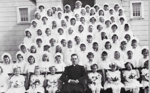 Rev. Gramza with Ss. Peter & Paul First Holy Communion Class, 1946 (SS. PETER & PAUL 50TH YEAR 1923 – 1973)