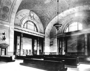 Michigan Central Station empty waiting area with benches and chandelier, ca. 1916