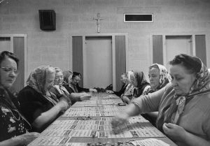 A timeless photo of Polish American women playing bingo at an unknown location.