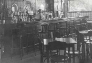 John Michno stands behind the bar in a hazily lit Michno’s Café at 4401 Central Street in Southwest Detroit, ca. 1939, shortly after purchasing the establishment.