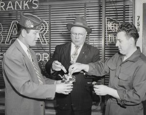 Frank B. Michno, owner of Frank’s Bar at 7505 Michigan Avenue between 51st and 52nd Streets in Southwest Detroit, supporting the Sgt. Stanley F. Romanowski Post No. 6896 at 4300 Lonyo, south of Michigan Avenue, during one of their annual Memorial Day or Labor Day fundraising events, ca. 1949.